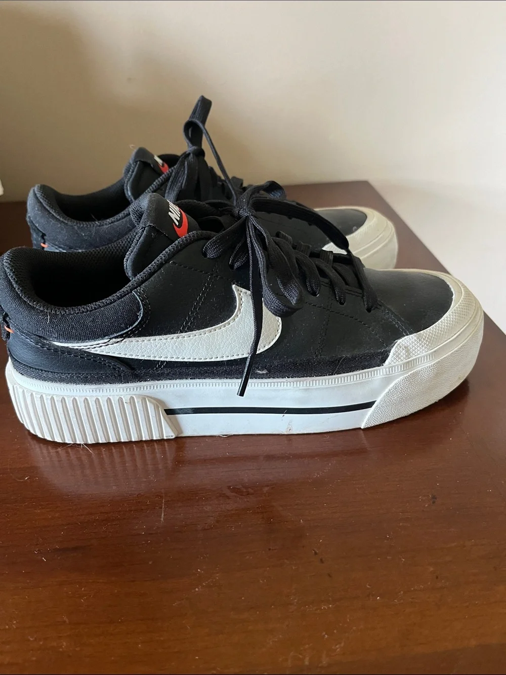 Nike Women’s Black Sneakers with White Swoosh and Red Tongue Logo